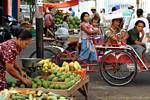 Image street, fruits and tricycle, Java, Indonesia.