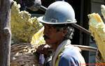 Portrait of a sulfur-bearing weighing center, Kawah Ijen, Java, Indonesia.