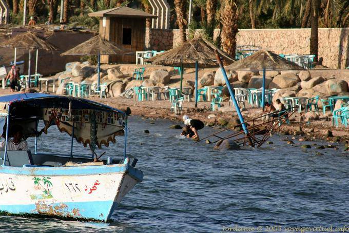 Chairs and umbrellas on the beach in the center of Aqaba - Jordan