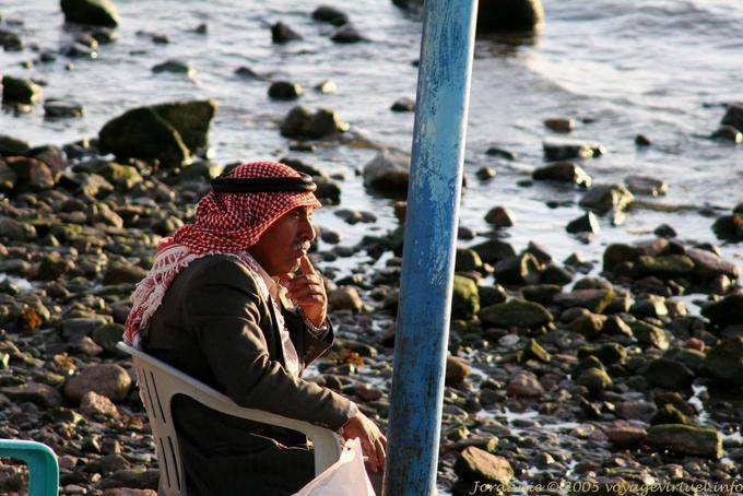 Jordan thoughtfully at the water's edge, Aqaba - Jordan