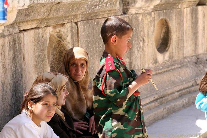 Spectator and kid in uniform, Southern theater, Jerash - Jordan