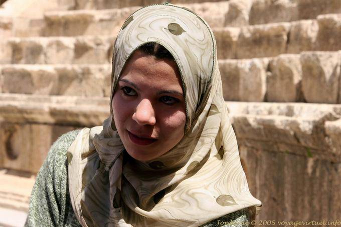 Young woman in headscarf in the theater, Jerash - Jordan