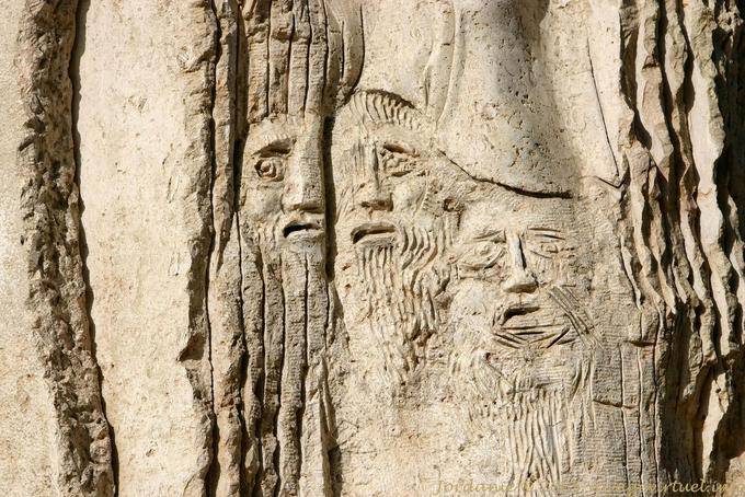 Sculpted heads close-up of the Millennium Monument Mount Nebo - Jordan