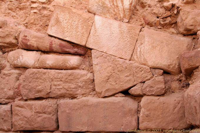 Stones composition forming a wall of the temple, Petra Lower City - Jordan