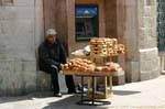 Merchant of bread before an ATM, Amman, Jordan.