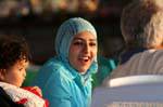 Laughing young woman at sunset, Aqaba, Jordan.
