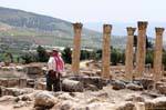 Man in kefieh admiring the scenery, Jerash, Jordan.