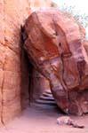 Passage of the stairs under a fallen rock, Petra Deir, Jordan.