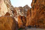 Tourists on the path between rocks, Petra Siq, Jordan.
