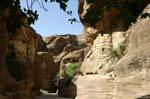 Narrowness of the passage between the walls of the parade Siq, Petra, Jordan.