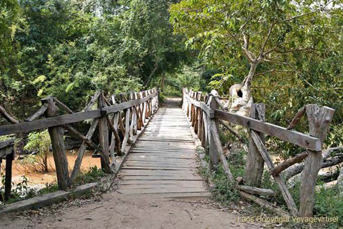 Wooden bridge on the path of Li Phi falls, Khone Island, Lao