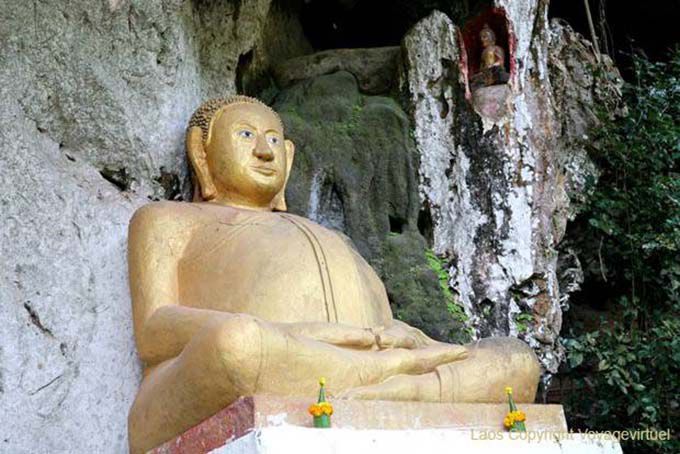 Potbellied Buddha at the entrance of Tham Phum, Pak Ou, Lao