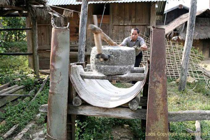 Grinding grain by hand, Hmong, Xieng Khouang, Lao