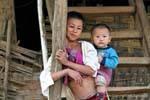 Very young mother and child, Thai Dam, Xieng Khouang, Lao.