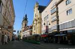 Landstrasse, churches and trams, Linz, Austria.