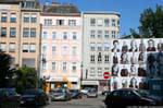 Schiller Platz, faces on a pub, Linz, Austria.