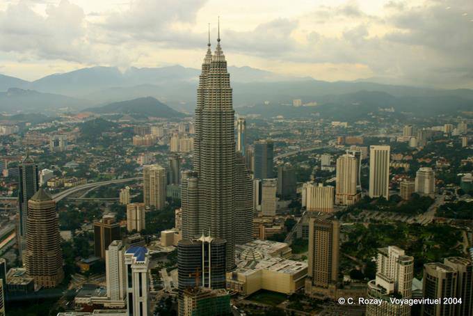 Profile of Petronas and mountains in the distance from KL Tower, Kuala Lumpur - Malaysia