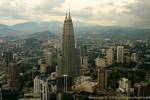 Profile of Petronas and mountains in the distance from KL Tower, Kuala Lumpur, Malaysia.