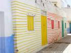 Wall painted multicolored lines, Asilah, Morocco.