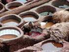 The hard work of the dyer in the tank with ceramic walls, Fes, Morocco.