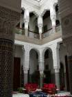 Stucco columns and zelliges Patio Moroccan palace Riad Fes, Morocco.