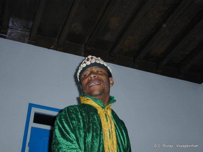 Smile of one who plays qraqechs Gnaouas Dar Kenavo - Morocco