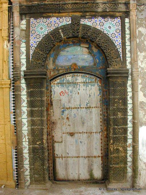 Antique door surrounded by tiles, Essaouira - Morocco