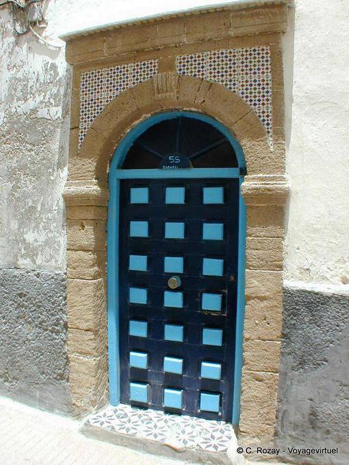 Checkered door with a stone frame, Medina, Essaouira - Morocco