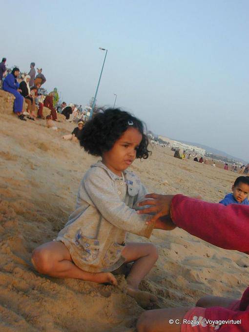 A little girl playing on the beach Tagharte, Essaouira - Morocco