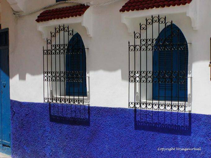 Shadow of wrought iron and colors in the medina, Asilah - Morocco