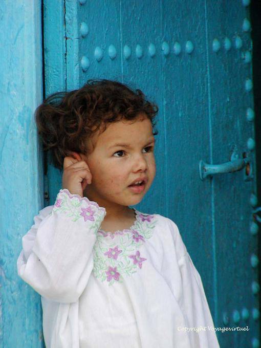 A child at a door, Chefchaouen - Morocco