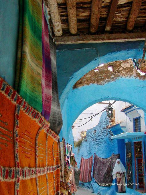 Colored carpet in a covered walkway from the souk, Chefchaouen - Morocco