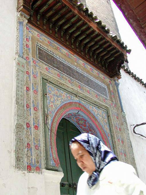 Face in front of a multicolored gate Fes - Morocco