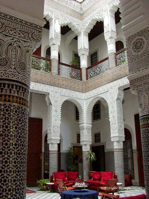 Stucco columns and zelliges Patio Moroccan palace Riad Fes - Morocco