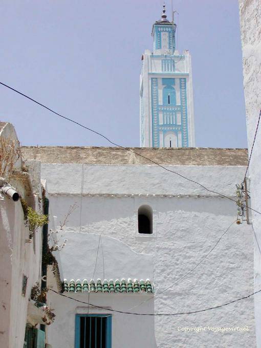 The blue and white minaret of a mosque in the Medina, Larache - Morocco
