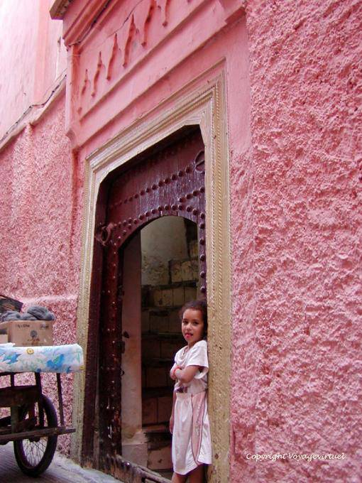 The little girl in pink who pulls the tongue, Marrakech - Morocco