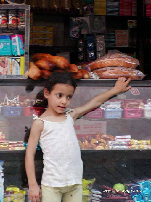 A girl in front of a shop, Marrakech - Morocco