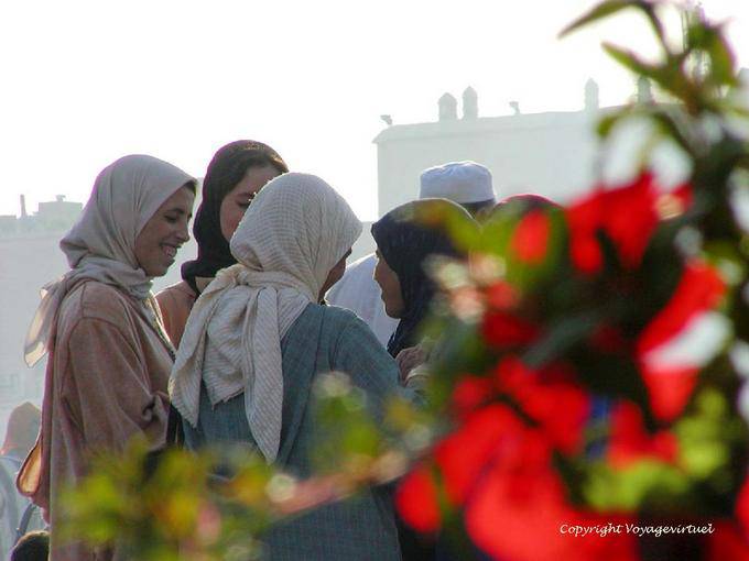 Female gossip in the smoke of the Djemaa el Fna, Marrakech - Morocco
