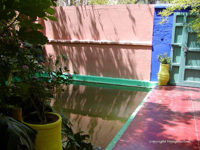 Multicolored harmony between door and basin, Majorelle Garden, Marrakech - Morocco