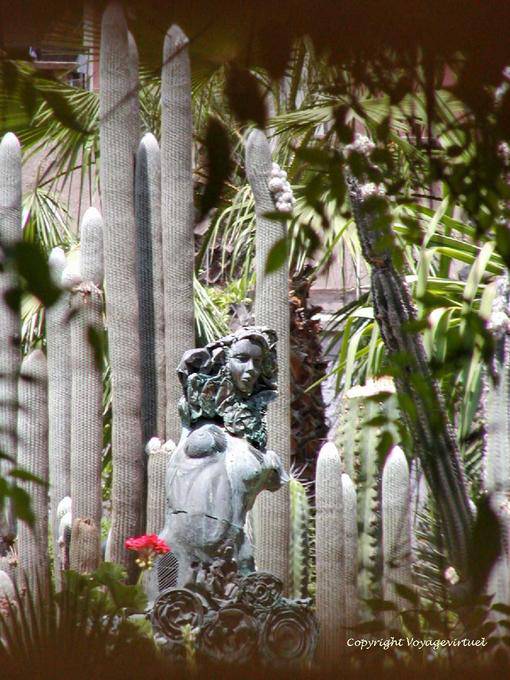 Statue in the middle of cactus, Jardin Majorelle, Marrakech - Morocco