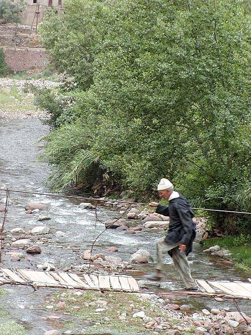 The hazardous crossing a shabby monkey bridge, Ourika Valley - Morocco