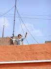 Joy of the girl on a roof, Marrakech, Morocco.