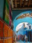 Colored carpet in a covered walkway from the souk, Chefchaouen, Morocco.