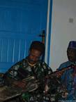 Gnaoua playing on a guembri instrument maâlem Dar Kenavo, Morocco.
