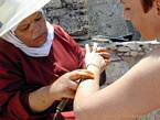 A henna tattoo artist officiating near the ramparts, Essaouira, Morocco.
