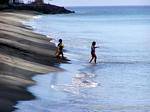 Racing on the black sand beach, Anse Turin, Martinique.