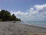 Gray sandy beach, Le Carbet, Martinique.
