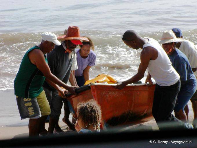 Lift the boat on the beach after fishing, Petite Anse - Martinique
