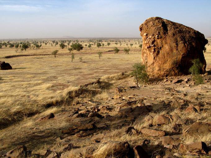 Rock and view of the road to M'bout Souffa, Mauritania