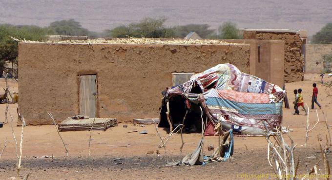 Traditional house and tent outside, Road of Hope, Mauritania